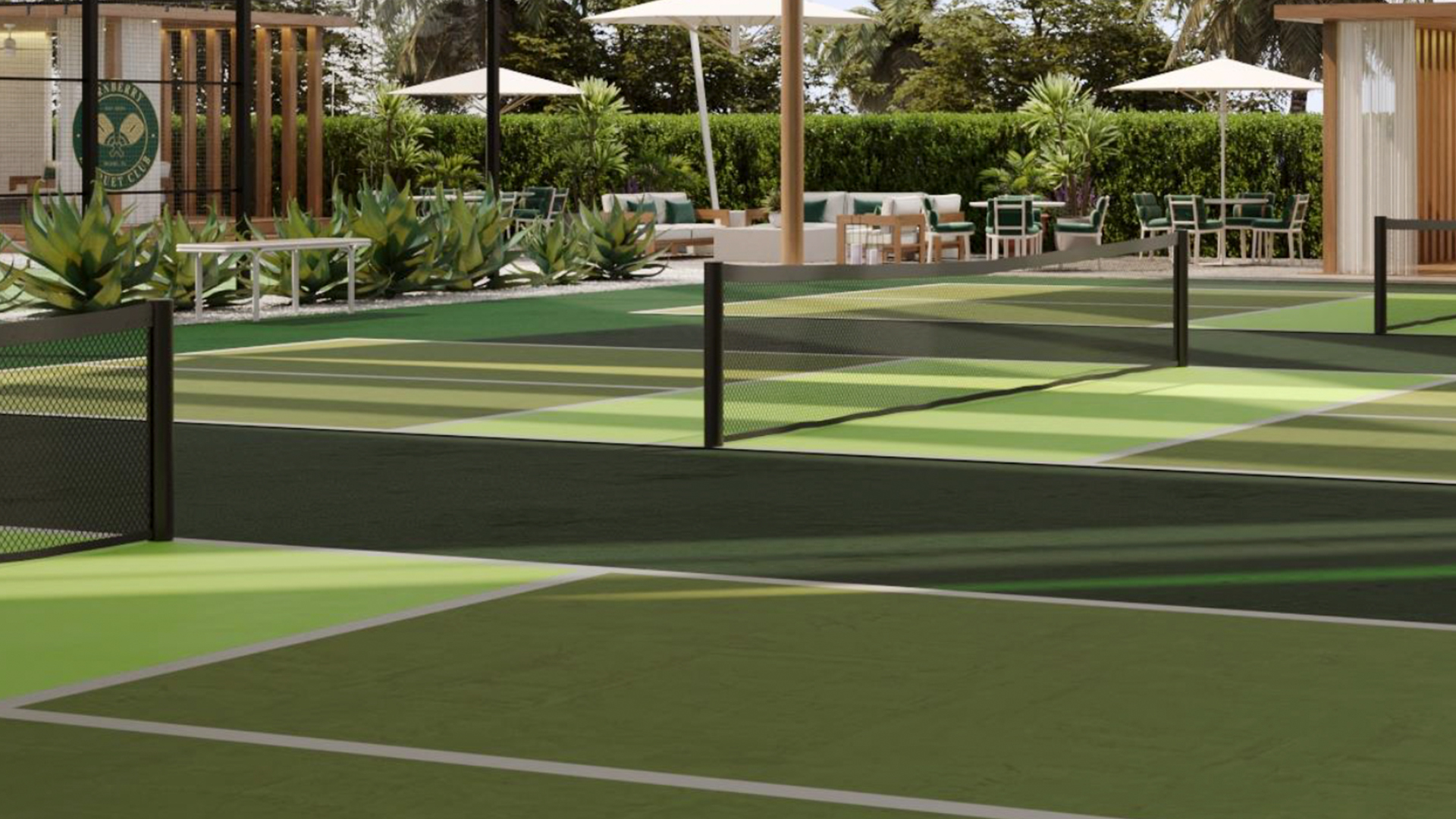 a tennis court with a net and chairs