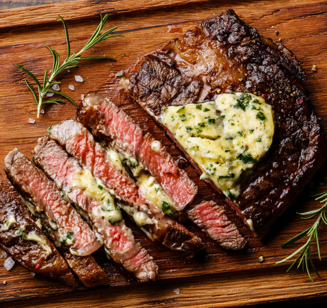 a steak with butter on top of it
