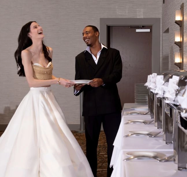 a man and woman smiling at each other