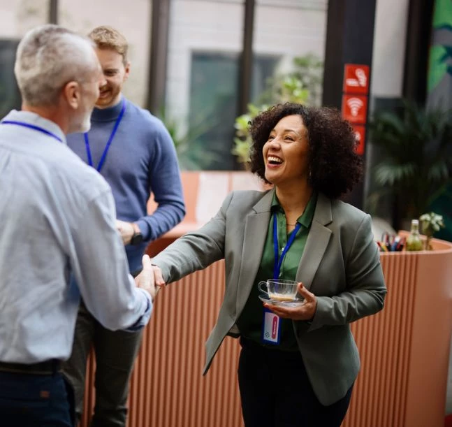 a woman shaking hands with a man