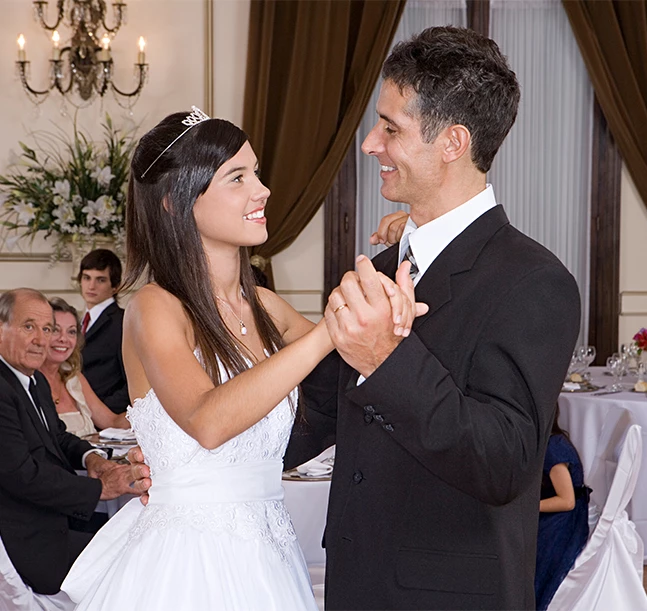 a bride and groom dancing at a wedding