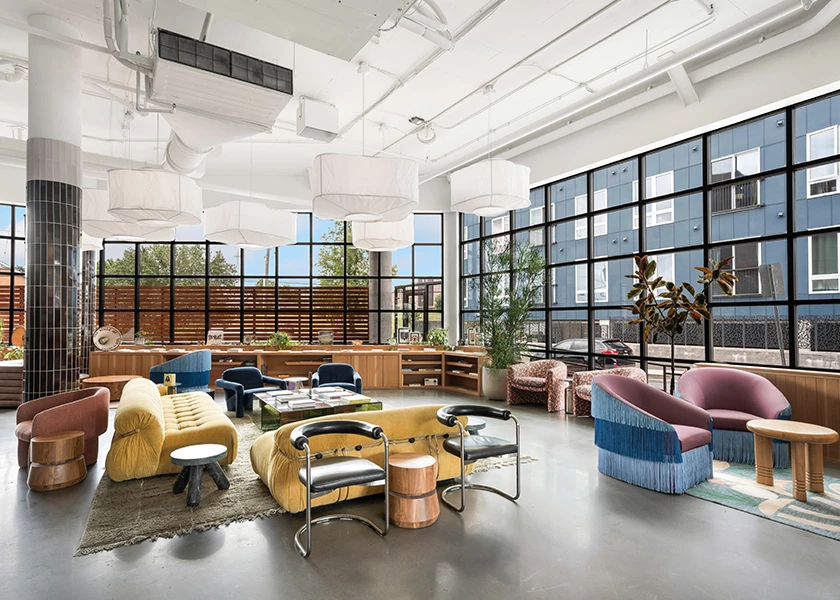 A large, bright lobby with a high ceiling and large windows.