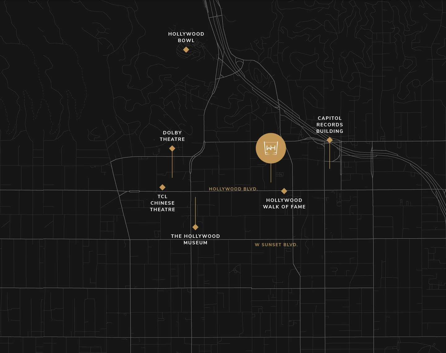 a tall blue sign with a palm tree in front of it