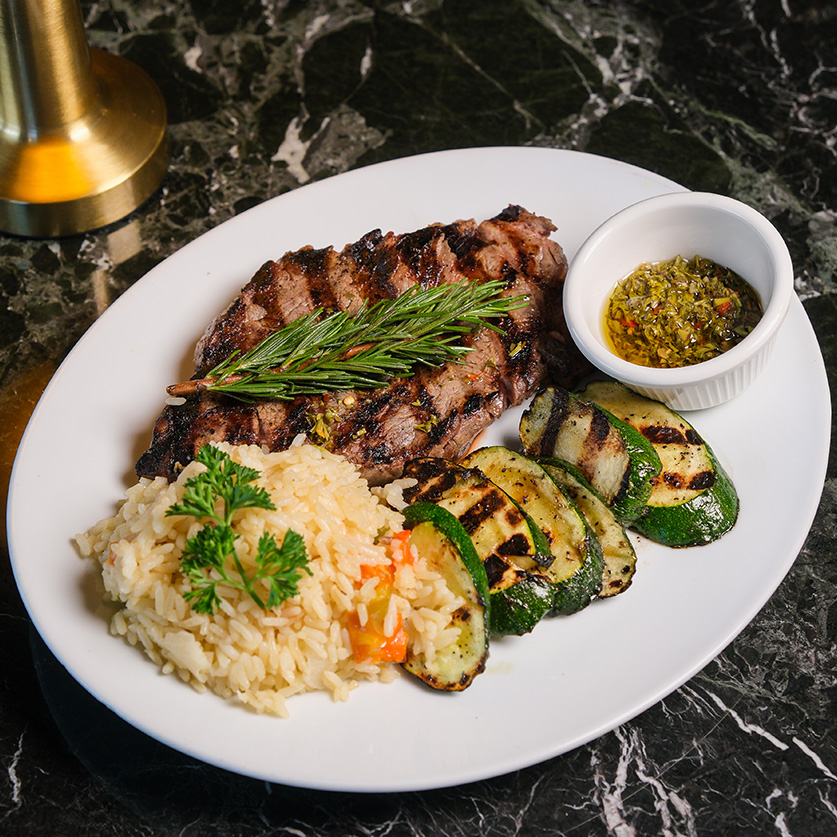 a plate of meat and vegetables