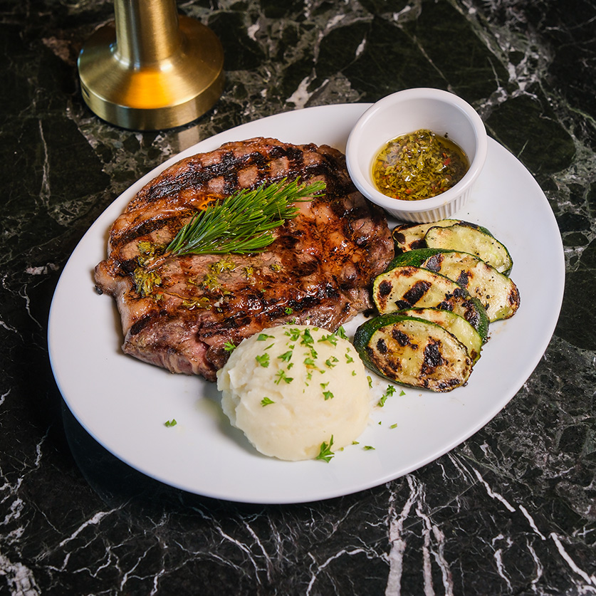 a plate of food on a marble surface