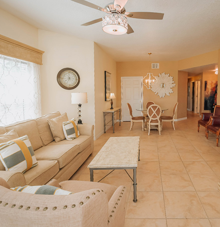 a living room with a ceiling fan