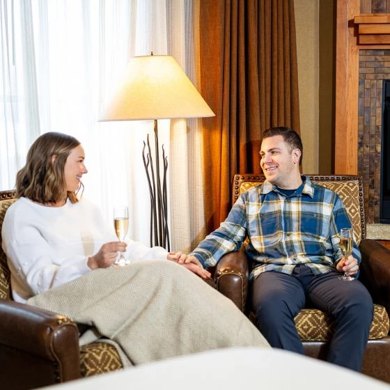 a man and woman sitting in chairs