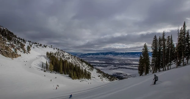 a group of people skiing on a snowy mountain