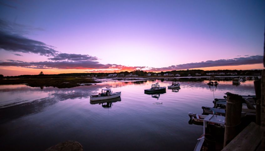 boats on the water at sunset