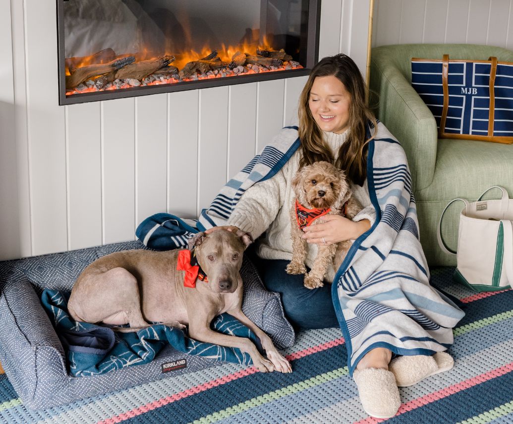 Prelude Paws Yachtsman Hotel & Marina Club Kennebunkport Maine \ a woman sitting on the floor with two dogs