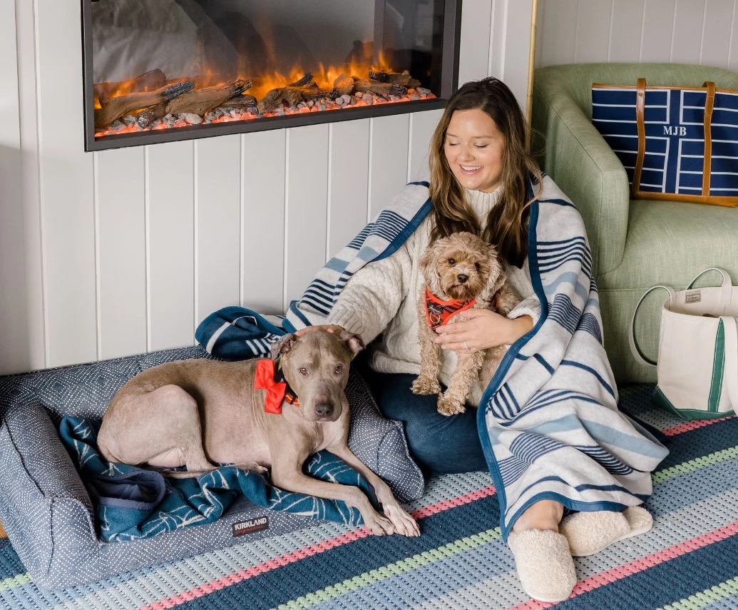 Prelude Paws Yachtsman Hotel & Marina Club Kennebunkport Maine \ a woman sitting on the floor with two dogs