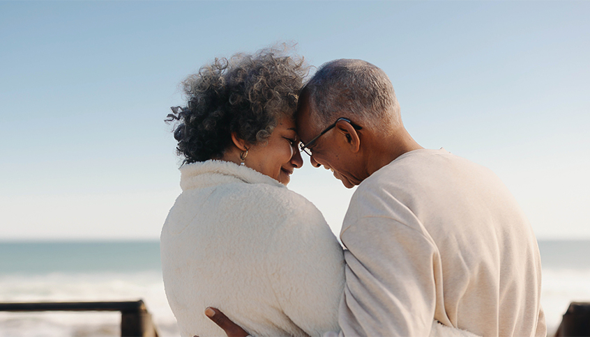 a man and woman hugging each other