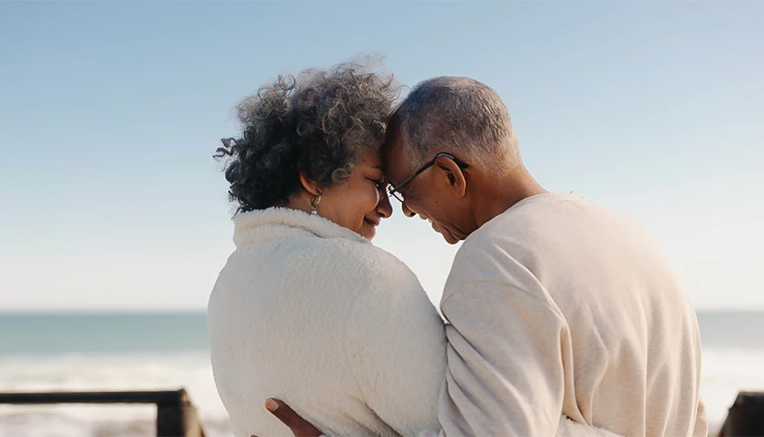 a man and woman hugging each other