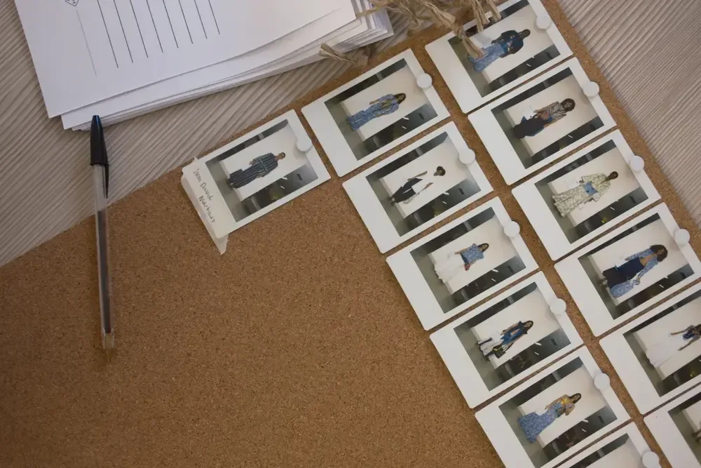 a cork board with pictures of women on it
