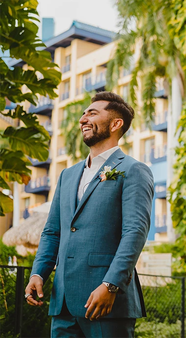 a man in a suit smiling