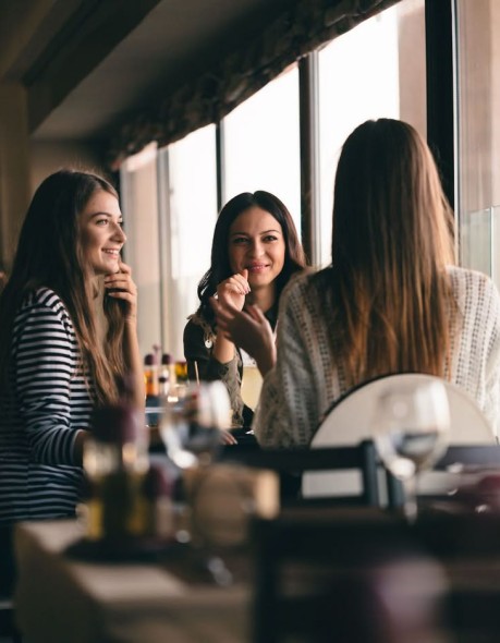 a group of women sitting at a table
