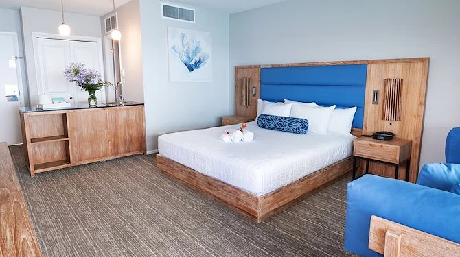 king bed with blue and wooden bed frame