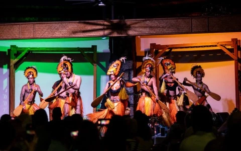 a group of people in clothing on a stage