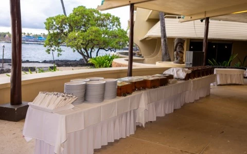 a long table with plates and forks
