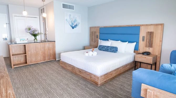 oceanfront room with king bed and a sofa