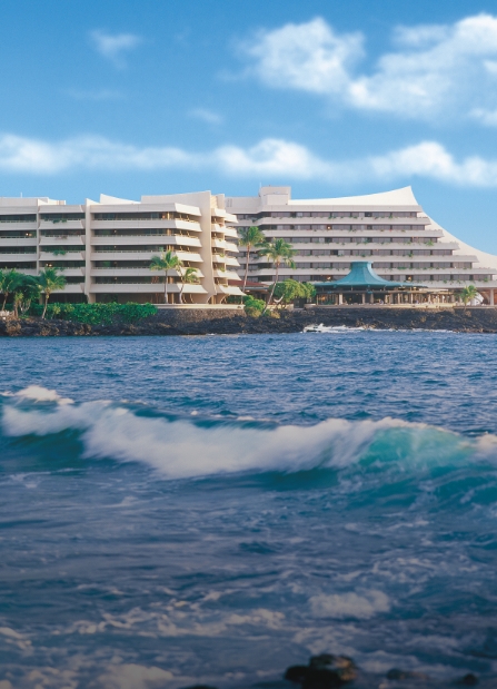 a large building next to a body of water