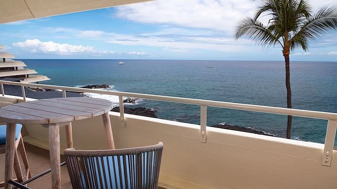 oceanfront balcony with a chair