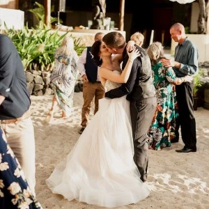 newlyweds kissing while they dance
