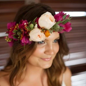 woman with a red flower crown 
