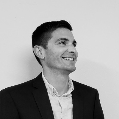 a man in a suit smiling