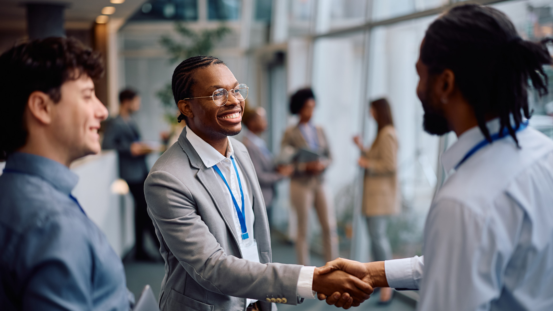 a man shaking hands with another man