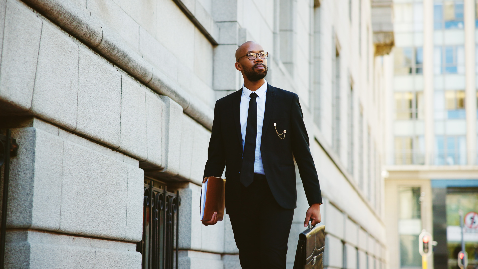 a man in a suit holding a briefcase