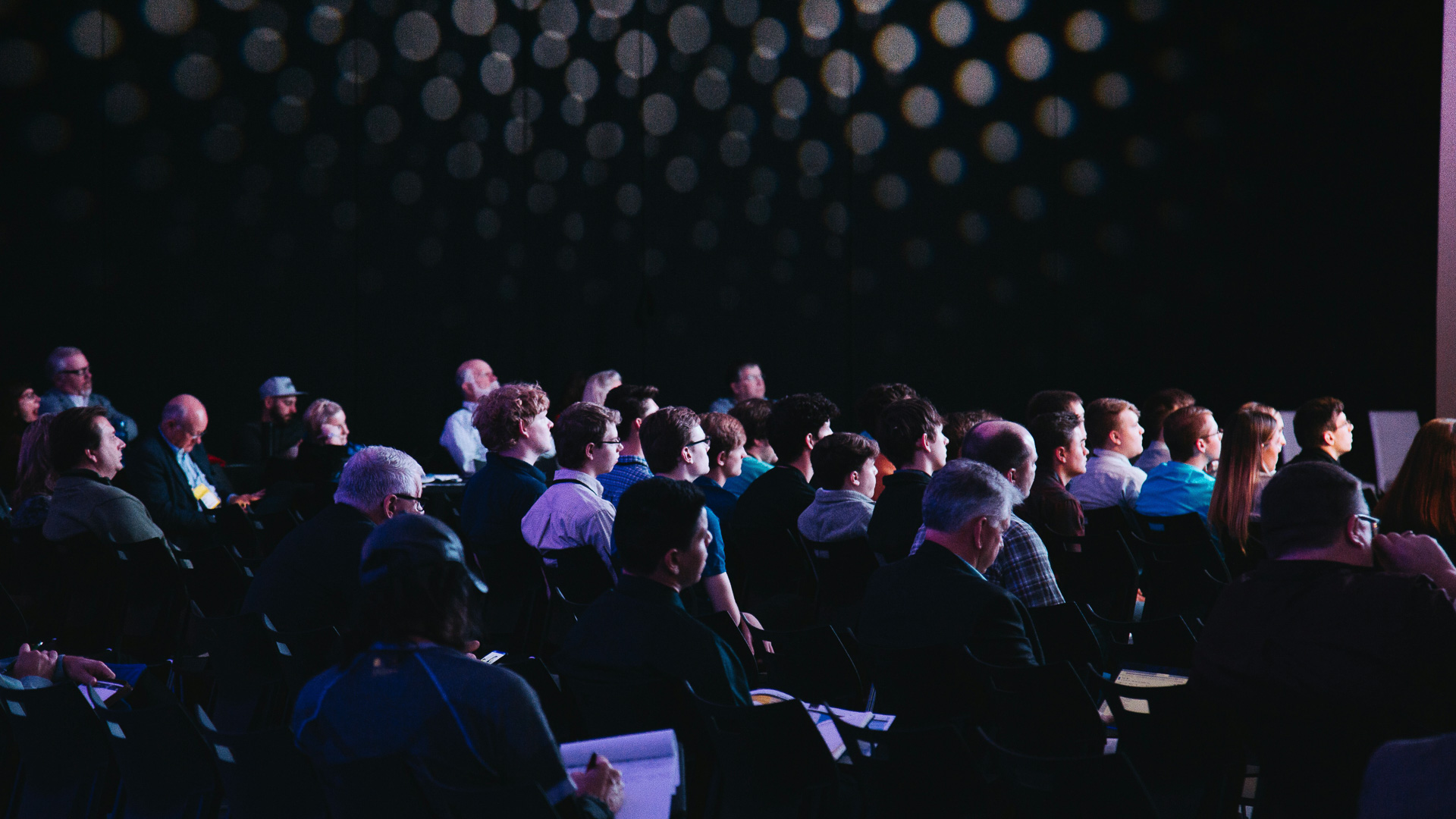 a group of people sitting in chairs