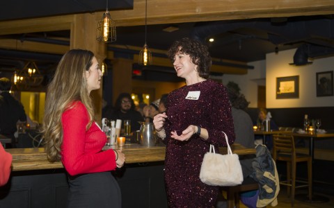a woman talking to another woman