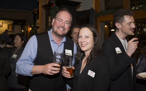 a man and woman holding drinks