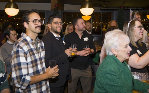 a group of people holding drinks