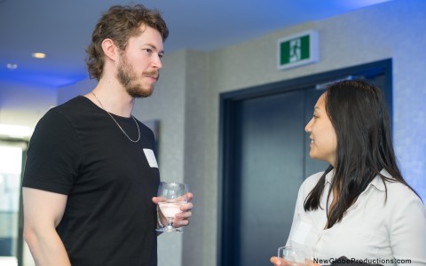 a man and woman holding glasses