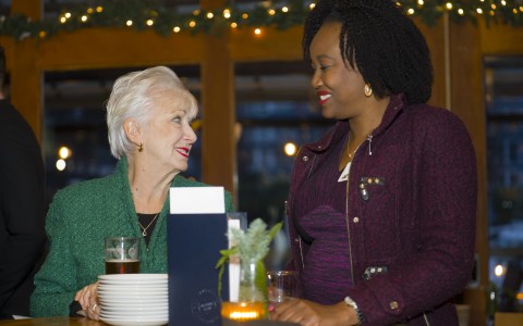 two women sitting at a table