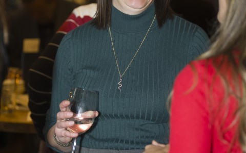 a woman holding a wine glass