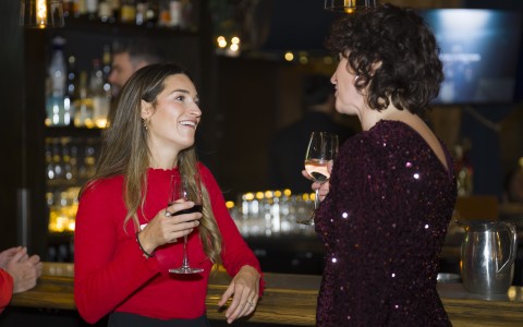 a group of women drinking wine
