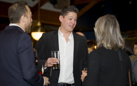 a man holding a glass of beer