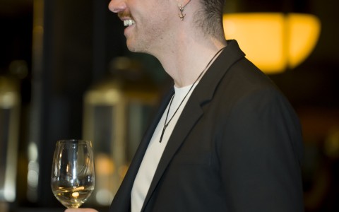 a man holding a wine glass