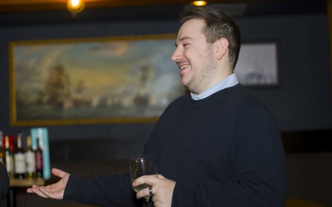 a man holding a wine glass
