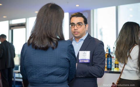 a man in a suit talking to a woman