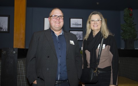 a man and woman smiling at camera