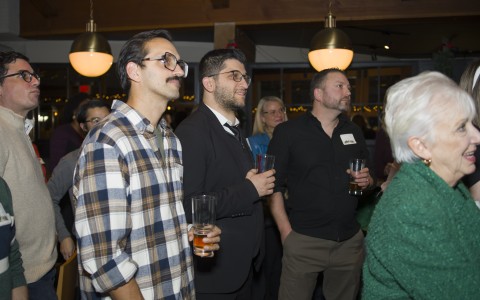 a group of people standing in a room
