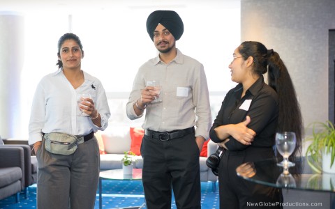 a group of people holding drinks