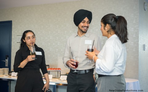 a group of people holding drinks