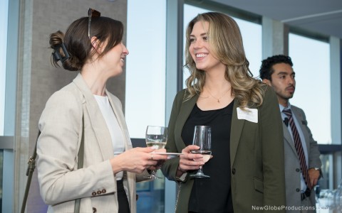 a group of women holding wine glasses