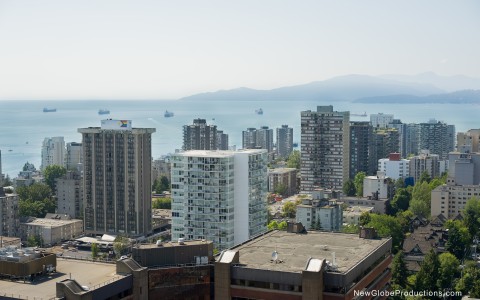 a city with many tall buildings and a body of water