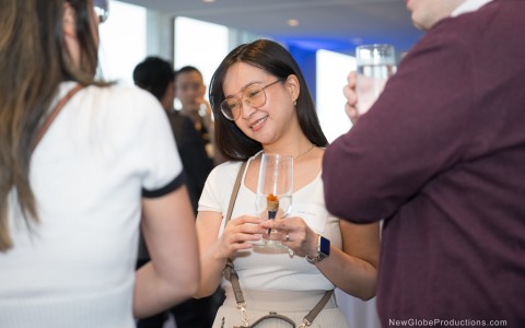 a woman holding a glass of wine